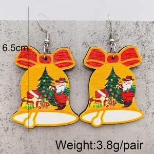 Detail of wooden bell-shaped earrings with Christmas patterns and 6.5cm size mark