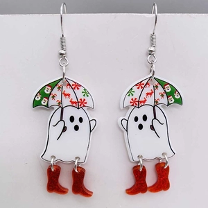 Detail shot of acrylic Christmas ghost earrings with glittery boots and festive umbrella