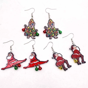 Christmas earrings set featuring funny Santa Claus and festive cat pendants with colorful bells