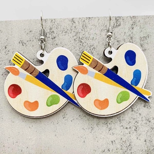 Artistic wooden palette and paintbrush earrings with colorful paint spots for teachers