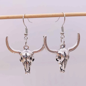 Retro bull skull drop earrings with vintage silver finish in western bohemian style