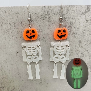 Luminous Halloween drop earrings with orange pumpkins and glowing skeletons