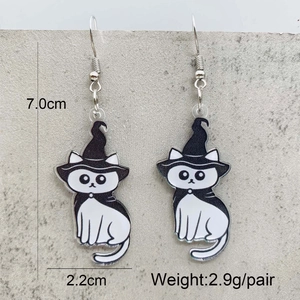 Detail view showing Halloween acrylic cat earrings with wizard hat dimensions and weight