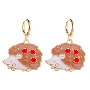 Detailed view of cute hedgehog earrings with brown enamel and red cherry patterns
