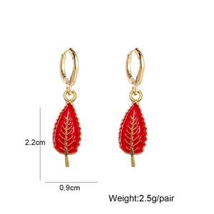 Detail view of gold maple leaf drop earrings with dimensions of 2.2cm height and 2.5g weight