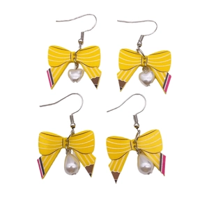 Creative pencil bow acrylic earrings with heart and teardrop pearl charms on white base