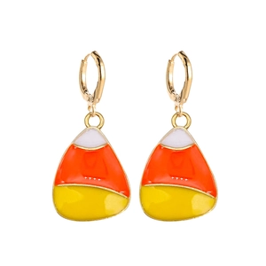 Detail of candy corn drop earrings with festive white orange and yellow enamel finish