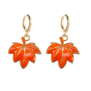 Detailed macro view of orange maple leaf earrings with gold enamel borders for Thanksgiving