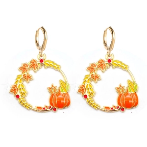 Detail of Thanksgiving hoop earrings featuring colorful maple leaves and a pumpkin charm