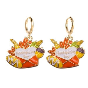 Detail of Thanksgiving envelope earrings with autumn leaves and festive harvest patterns