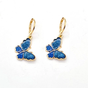 Golden leverback earrings with dark blue glitter enamel butterfly charms for women