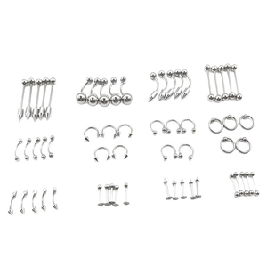 Assorted set of stainless steel body piercing jewelry including nose and navel rings