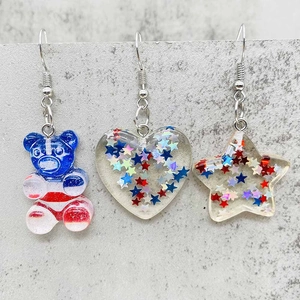 Acrylic Independence Day earrings featuring star and heart charms with USA flag pattern