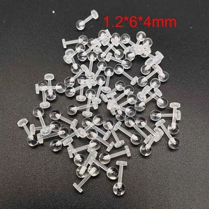 Macro view of clear acrylic ear bone studs with 1.2mm threaded post and round ball top