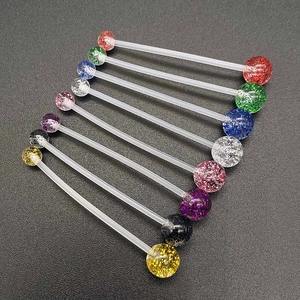 Close-up of flexible navel rings with colorful glitter acrylic beads in 10 colors