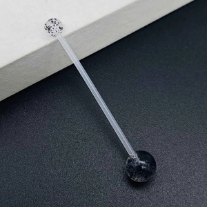 Macro detail of flexible bio-plastic industrial barbell with speckled accent beads