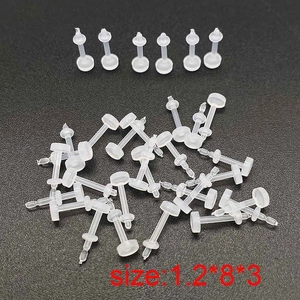 Close-up of flexible transparent acrylic nose studs in size 1.2x8x3mm for body piercing
