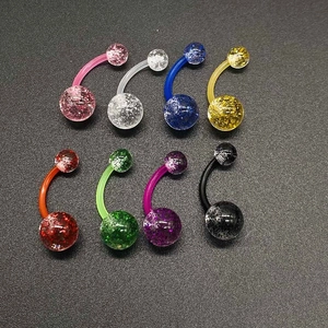Detailed view of multi-color acrylic belly rings set with glitter interior