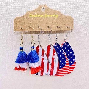 Three-pair American flag earring set with wood prints and tassels on display card