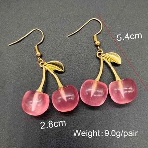 Pink resin cherry drop earrings with gold leaves showing 5.4cm height dimensions