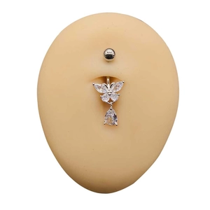 Detail of silver navel ring with crystal butterfly pendant on medical silicone model