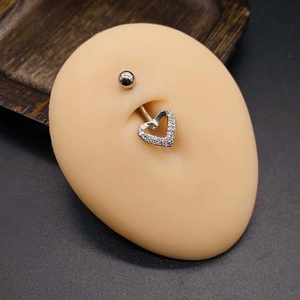 Silver stainless steel belly button ring with heart-shaped zircon pendant on silicone model