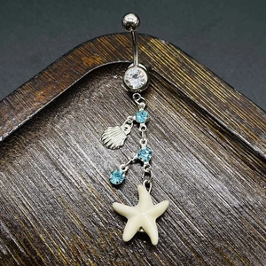 Piercing all'ombelico in acciaio con pendente a stella marina e cristalli blu