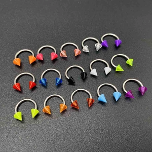 Detailed set of colorful circular barbells with acrylic spikes and stainless steel rings