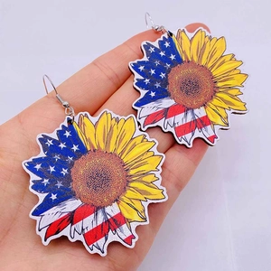 Wooden sunflower drop earrings featuring American flag stars and stripes pattern design