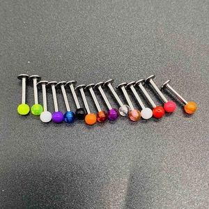 Detail view of 16-piece acrylic labret studs set with colorful balls and flat metal base