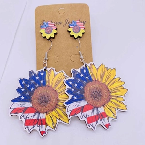 American flag sunflower wooden drop earrings on a jewelry display card for Independence Day