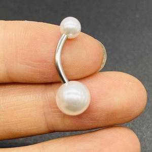 Short stainless steel belly button ring with two white pearls on a curved barbell