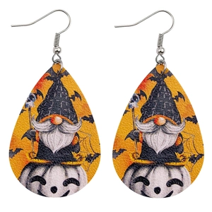 Detail of faux leather teardrop earrings featuring a gnome on a pumpkin and bats