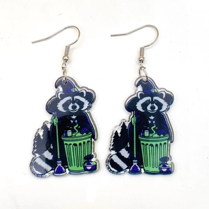 Halloween wizard raccoon hook earrings with purple hat and green trash can details