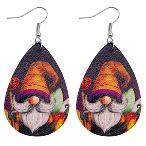 Close-up of teardrop faux leather earrings with Halloween gnome and pumpkin pattern