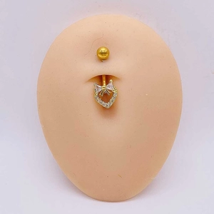 Piercing de nombril en acier doré avec pendentif cœur, nœud papillon et zircons cubiques
