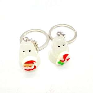 Halloween ghost keychain set with Santa and candy details in glowing resin