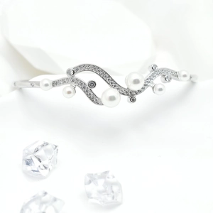 Elegant 18k gold plated wave bangle with micro-set zircons and pearls on white petals