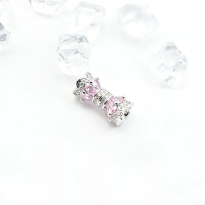 Exquisite silver bow necklace clasp with pink pear-shaped zircon and white micro-pave stones