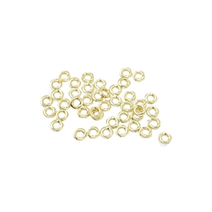 DIY jewelry parts featuring twisted gold alloy spacer rings in a bulk arrangement
