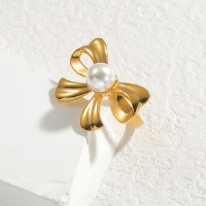 Elegant gold bow ring with white pearl on white silk ribbon, premium stainless steel jewelry