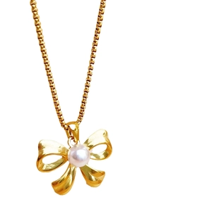 Elegant gold titanium steel necklace with a pearl bow pendant and matching box chain