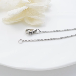 Polished stainless steel twist chain with lobster clasp and floral decoration