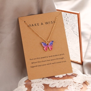 Bohemian gradient butterfly pendant necklace in gold finish on a wish card display