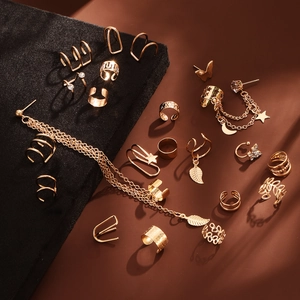 22-piece gold ear cuff set with leaf pendants, butterfly designs and white rhinestones