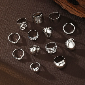 Set of 12 silver-colored lava and geometric stackable metal rings for women