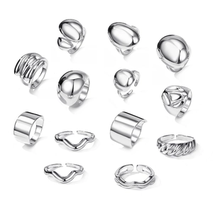 13-piece silver geometric ring set with organic fluid shapes and wavy textured designs