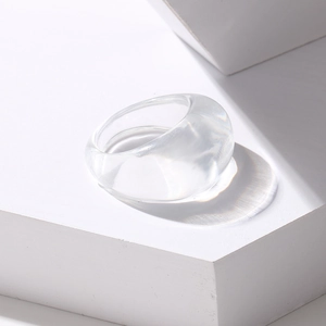 Minimalist thick dome resin ring in transparent finish on geometric block