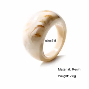 Minimalist white resin ring with light brown marble pattern and polished wide band