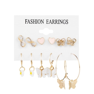 Detail of 6-pair earring set featuring gold-tone butterflies, hearts, and daisies